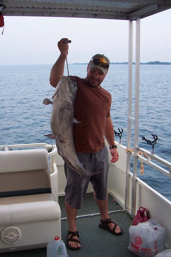 SHANE WITH THE FIRST OF 18 FISH FOR  THE EVENING, A 20LB+ BLUE!   6-27-08